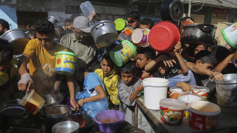 Israeli Troops Fire Near Starving Palestinians at Gaza Aid Centre Israeli Troops Fire Near Starving Palestinians at Gaza Aid Centre